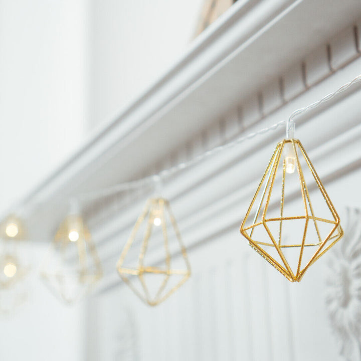 10 LED Gold Diamond Fairy Lights displayed on a mantle