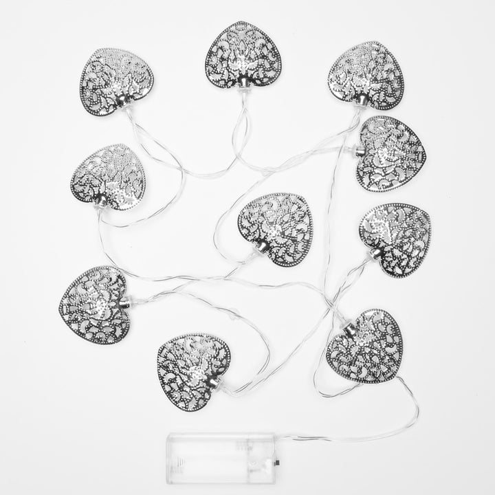 Group of Silver Filigree Heart Fairy Lights on a white background