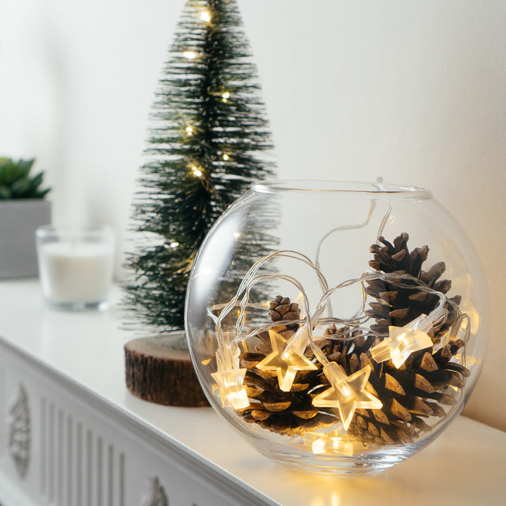 Glass bowl with pine cones and a Christmas tree lit by 10 LED Star Lights