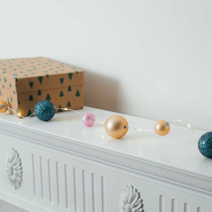 15 LED Bauble Fairy String Light next to a gift box