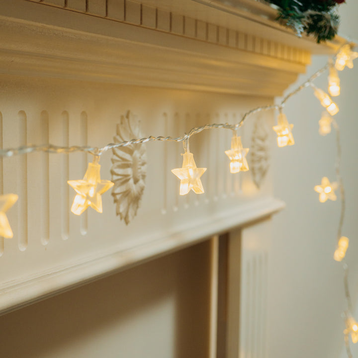 Fireplace adorned with star-shaped LED lights