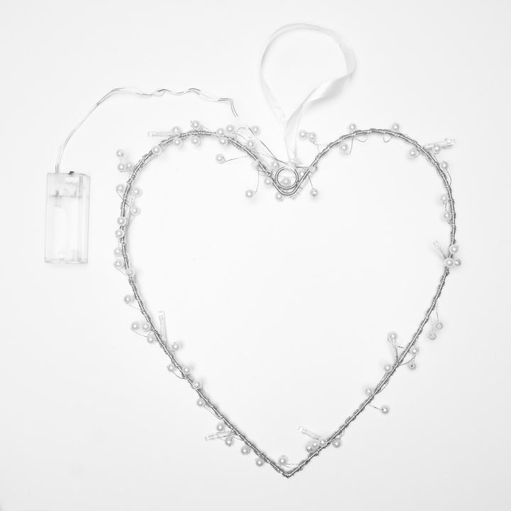 Heart Wreath Fairy Light in a heart shape with pearls hanging from it